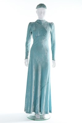 Lot 219 - A pale blue crushed velvet bias cut gown,...