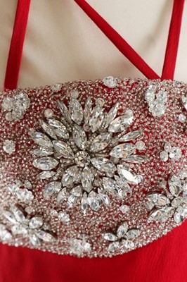 Lot 236 - A James Galanos red silk crepe and rhinestone...
