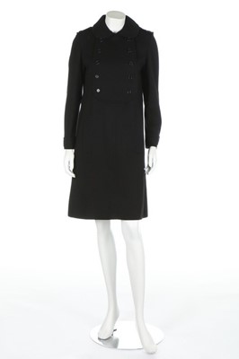 Lot 261 - A Saint-Laurent black wool jersey dress from...