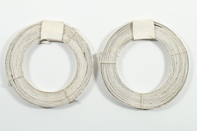 Lot 124 - Two un-used coils of baleen corsetry struts,...