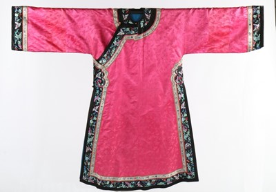 Lot 395 - A pink damask satin woman's informal robe -...