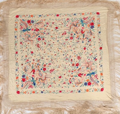 Lot 388 - An embroidered pale yellow silk shawl,...