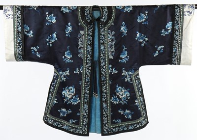 Lot 393 - A woman's embroidered navy satin informal robe,...