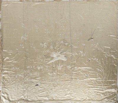 Lot 394 - An embroidered ivory satin coverlet, Chinese...