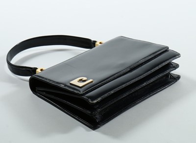 Lot 9 - A Pierre Cardin navy leather handbag, circa...