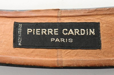 Lot 35 - A Pierre Cardin navy patent belt with swirl...