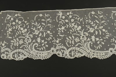 Lot 321 - A Brussels appliqué lace flounce, circa 1900,...