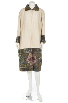 Lot 151 - An ivory linen-silk coat with Turkish...