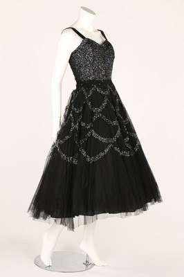 Lot 81 - Two prom style dresses, 1950s, one black with...