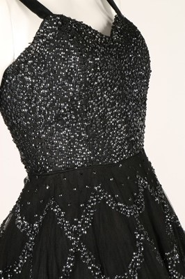 Lot 81 - Two prom style dresses, 1950s, one black with...