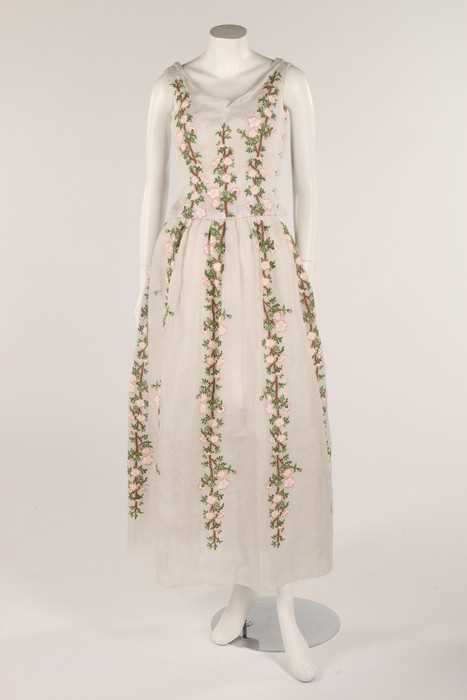 Lot 93 - A white organza dress embroidered with wild...