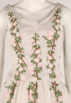 Lot 93 - A white organza dress embroidered with wild...