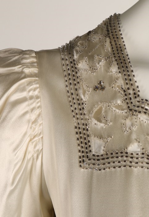Lot 95 - A velvet bias-cut bridal gown, 1930s, with