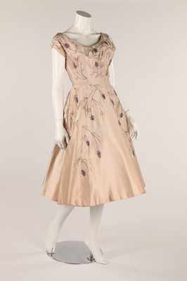 Lot 96 - Two cocktail dresses, late 1950s, one of pale...