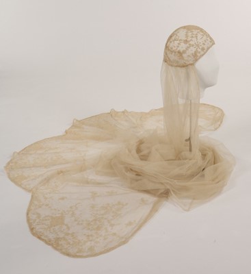 Lot 99 - A tamboured net bridal veil, circa 1920,...