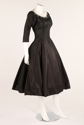 Lot 104 - Three little black dresses, late 1950s-early...