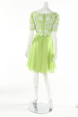 Lot 108 - Two lime green chiffon cocktail dresses, 1960s,...