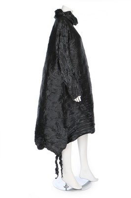 Lot 186 - An Issey Miyake pleated black polyester dress,...