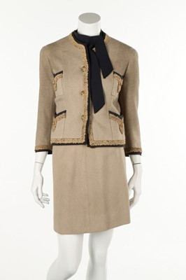 Lot 130 - A Chanel couture brown wool suit, circa 1957-8,...