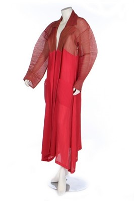 Lot 187 - An Issey Miyake two-tone red pleated polyester...