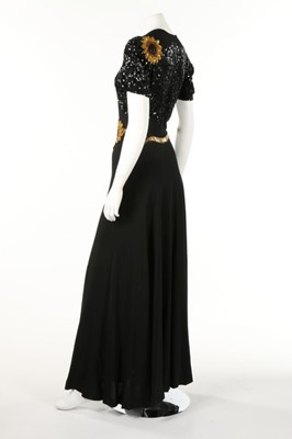 Lot 158 - Two glam evening dresses, 1970s, one decorated...
