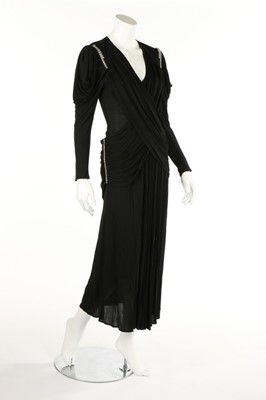 Lot 157 - Two black jersey dresses, 1970s, both...