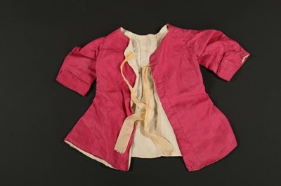 Lot 322 - A pale pink silk baby jacket, late 18th...