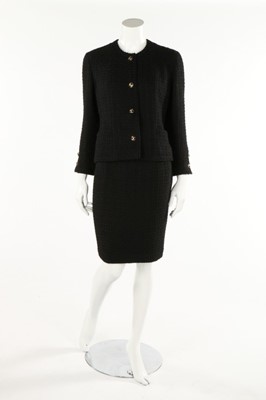 Lot 197 - A Chanel black wool suit, boutique labelled,...