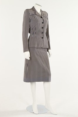 Lot 219 - A Mainbocher couture navy and grey striped...