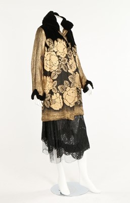 Lot 230 - An Ira black and gold lamé evening coat, late...