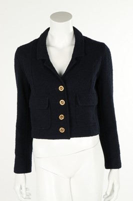 Lot 232 - A Chanel navy boucle wool jacket, circa 2000,...