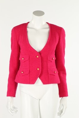 Lot 231 - A Chanel hot pink boucle wool jacket, 1993,...