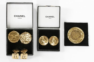 Lot 249 - Three pairs of Chanel ear-rings and a brooch,...