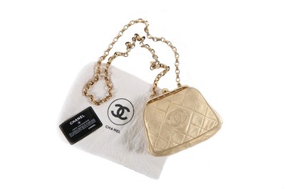 Lot 108 - A Chanel quilted gold leather mini bag, circa...