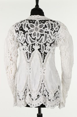 Lot 303 - A tape lace jacket, circa 1910, inset with...