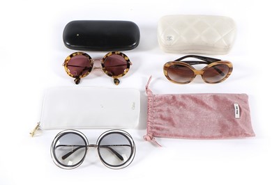 Lot 159 - A pair of Chanel sunglasses, 2000s, signed, in...