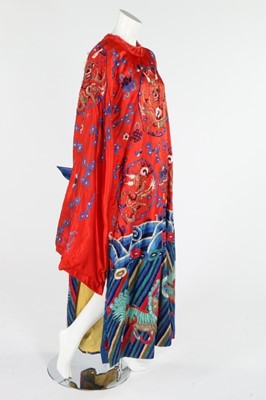 Lot 332 - A red satin theatrical dragon robe, Chinese,...