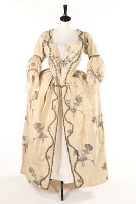 Lot 353 - A brocaded ivory silk and silver thread robe a...