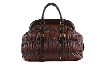 Lot 146 - A Prada brown ruched Nappa leather holdall,...