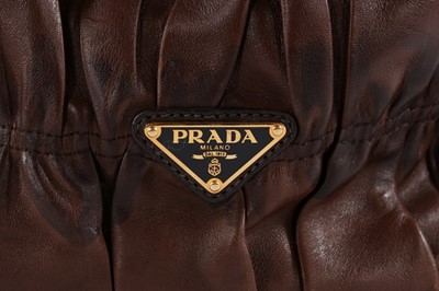 Lot 146 - A Prada brown ruched Nappa leather holdall,...