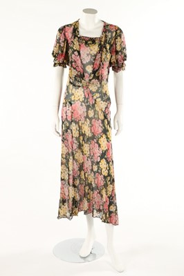 Lot 373 - Two printed chiffon garden party gowns, 1930s,...