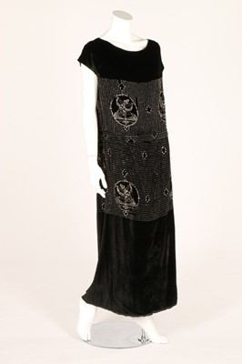 Lot 18 - Two beaded velvet dresses, early 1920s, one...