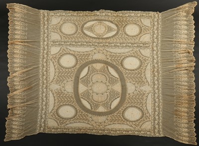 Lot 324 - An ecru lace coverlet, circa 1910, composed of...