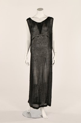 Lot 21 - A good black beaded chiffon dress, early to...