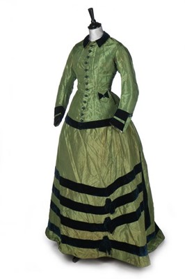 Lot 259 - An arsenic-green striped silk gown, circa 1870,...