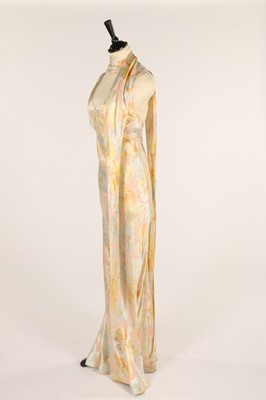 Lot 31 - A floral printed satin evening gown, late...