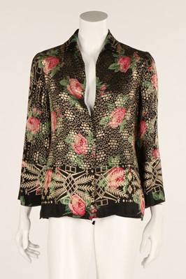 Lot 32 - A floral printed lamé jacket, 1930s, together...