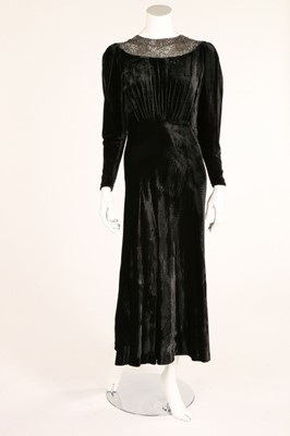 Lot 35 - A black velvet evening dress,1930s, neckline...