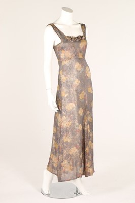 Lot 36 - A blue floral lamé evening gown, 1930s,...