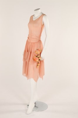 Lot 48 - A pale salmon pink chiffon dress, late 1920s,...